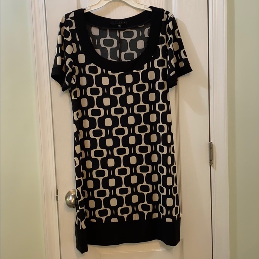 Black and cream dress. Nonsmoking home